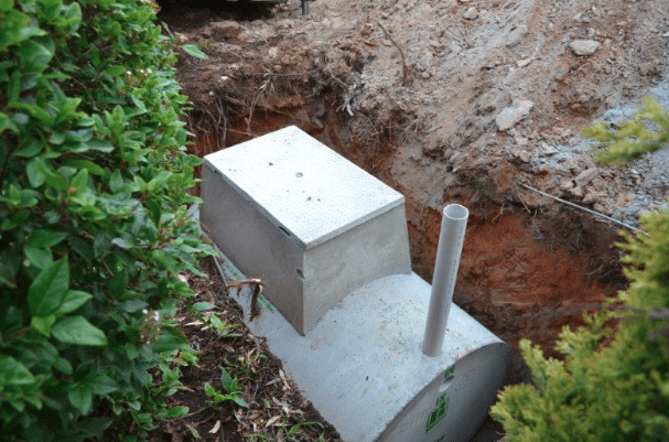 septic system exposed in ground